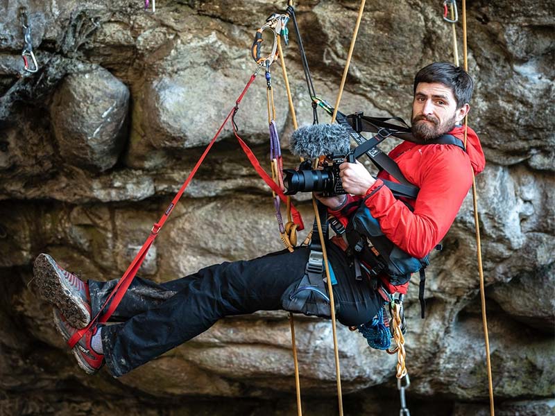 Barry O Reilly attached to a harness while filming a climbing film in Christchurch